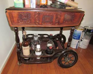 Leather and wood vintage rolling bar cart