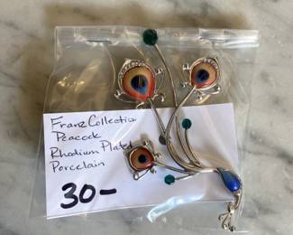 #190	Franz Collection Peacock Rhodium Plated Porcelain Pin	 $30.00 			
