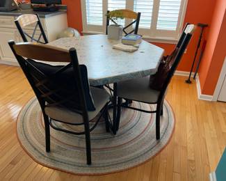 . . . great kitchen table and chairs on area rug