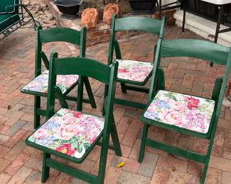 four green festive folding chairs