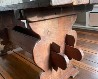 This Pilgrim Trestle Based Table from the 1700's  features a chestnut top, pine stretchers and oak bottom. 67” L X 30” W X 29.5” H