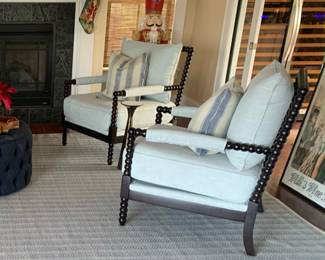 Spindle accent chairs (2 available) will take center stage in your home with their spool-styled wood carved legs.