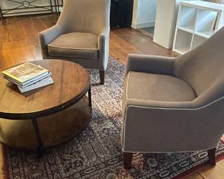 Dark gray Piper Accent Chairs with eye-catching piping.  This chair features a slanted back, slim sloping arms, a boxy seat cushion and dark tapered wooden legs.  35" W x 30" L