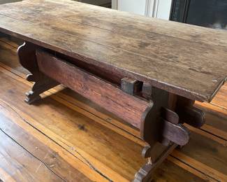 This Pilgrim Trestle Based Table from the 1700's  features a chestnut top, pine stretchers and oak bottom. 67” L X 30” W X 29.5” H