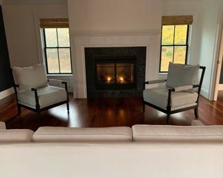 Spindle accent chairs (2 available) will take center stage in your home with their spool-styled wood carved legs.