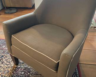Dark gray Piper Accent Chairs with eye-catching piping.  This chair features a slanted back, slim sloping arms, a boxy seat cushion and dark tapered wooden legs.  35" W x 30" L