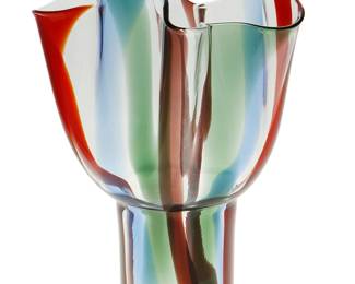 95
Timo Sarpaneva (1926-2006)
A "Kukinto" vase for Venini, 1992; Venice, Italy
Acid etched to underside: Venini / 92 / Sarpaneva
The Murano glass vase with cylindrical body and handkerchief neck in vertical bands of red, green, and blue
10.325" H x 7.25" W x 7.25" D
Estimate: $600 - $900