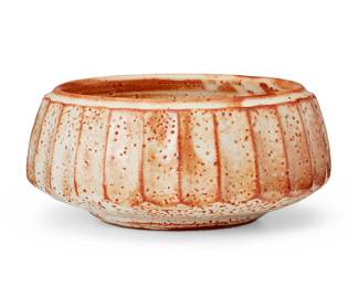 127
Warren MacKenzie (1924-2018)
A faceted Shino glazed ceramic bowl, mid-20th century
Appears unmarked
The bowl crafted in the Japanese Mingei style, with white Shino glaze over a faceted body
3.75" H x 8.5" Dia.
Estimate: $300 - $500