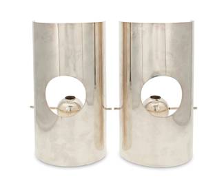 
100
Lino Sabattini (1925-2016)
A pair of candleholders, 1950s
Each with S logo above: Sabattini / Italy; each with stamped signature: Lino Sabattini; each further stamped: Concavo / S/2 / Collezione Sabattini Bregnano Italy
Each polished and plated metal candleholder with bulbous bobèche suspended on an adjustable bar for three heights, mounted to a concave half-cylinder screen
2 pieces
Each: 12.625" H x 7.5" W x 4.5" D
Estimate: $600 - $800