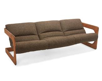 14
Lou Hodges (1937-2003)
A cantilever sofa for California Design Group, 1970s
Appears unmarked
The three-seater sofa with cantilevered oak wood frame with rounded edges joined by pegs and sling-form seat with woven heather brown textured upholstery
27.5" H x 84" W x 33" D
Estimate: $2,000 - $4,000