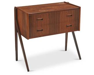 191
Mid-20th century
A Danish Modern Console Chest
Appears unmarked
The teak wood two-drawer chest with carved inset pulls and modified A-frame legs
26.75" H x 28.75" W x 15.25" D
Estimate: $400 - $600