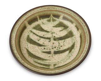 132
Harrison McIntosh (1914-2016)
A glazed stoneware rimmed bowl, mid-20th Century
Marked to the underside with potter's stamp: HM; further marked with paper label to the underside: Handthrown Stoneware / Harrison McIntosh / Claremont / California
With an all-over green glaze and tree motif to interior
1.75" H x 9.325" Dia.
Estimate: $700 - $900