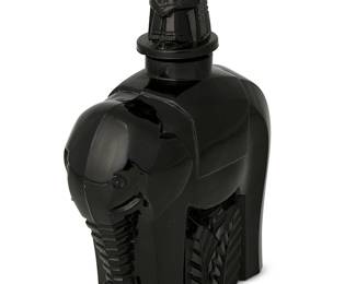 241
Circa 1930s; Verdun, France
A Maurice Model Figural Perfume Bottle
Marked faintly to underside: M Model / France
The French Art Deco black molded glass bottle in the shape of an elephant with a stopper in the form of a mahout rider figure
6.625" H x 4.75" W x 2.325" D
Estimate: $300 - $500