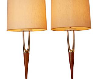 140
Gerald Thurston (1914-2005)
A pair of Wishbone table lamps, mid-20th century
Each appears unmarked
Each lamp with gold-toned metal and walnut wood body set on a gold-toned metal tapered square base, surmounted by a later added cylindrical shade banded at the top with a faux wood accent
2 pieces
Each with shade: 36" H x 14.5 Dia.
Estimate: $400 - $600