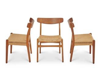 152
Hans Wegner (1914-2007)
Three CH 23 dining chairs, 1950s/60s century
Designed 1950
Each burn marked to underside frame: Made in Denmark / Y Carl Hansen & Son / Odense Denmark; further burn marked: Designer Hans Wegner
The oak wood chairs with curvilinear back rest and double-woven paper cord seats
3 pieces
Each: 30" H x 20.75" W x 19.5" D
Estimate: $500 - $800