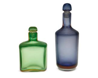 58
Mid-20th century; Venice, Italy
Two Venini Inciso Glass Bottles
Blue bottle with three-line acid-etched mark: Venini / Murano / Italia; green appears unmarked
Each Murano glass bottle with stopper, 2 pieces
Larger: 10.25" H x 3.5" Dia.; Smaller: 6.875" H x 4.25" W x 3.25" D
Estimate: $800 - $1,200