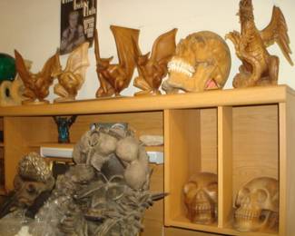 Gargoyles , Dragons , Skulls carved from Suar or mahogany , Nine inch Nails rock concert , Queens of the stone age rock poster...Dan masks Congo