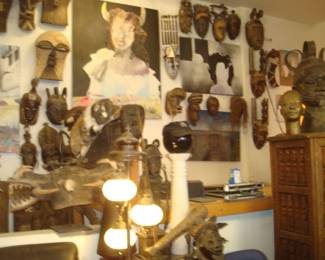 on left -Songe "Kefibwe" Masks .... Sunufo 2-headed"firespitters" on railing ... "Dogon" Cabinet on right ... Assorted "Baule" Masks 