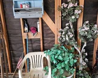 #10002 • Plastic Chair with End Table, Fake Plants and Shelf with Cleaning Products