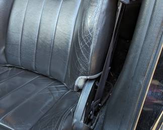 DRIVER'S SIDE FRONT SEAT, HAS WEAR ALONG EDGE