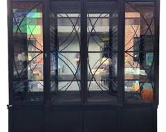 Fantastic Hickory Chair Company High End Four door Ash Grand Cabinet from the 1911 Collection Inspired by an antique Dutch neoclassical library cabinet the ash four door artisan grand cabinet is designed in the spirit of the craftsman that made the original modern version that incorporates slotted groove adjustable shelf supports raised pilasters and corner blocks and a striking reverse c grill pattern on the doors and the deck. A true beauty! This lot works well with lot 436 and 441
