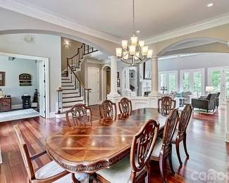 dining table with 8 chairs. 9’2” long x 43” wide. Measured with two leafs in. Each leaf is 18” long.