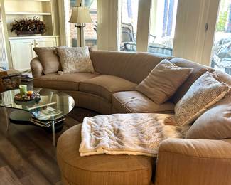 Curved shape neutral color sectional sofa by Expressions Custom Furnishings. Measures 12’ across