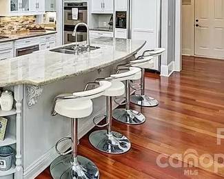 4 chrome & white leather barstools