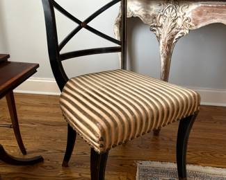 Antique Regency side chair in ebony and gold with brass feet