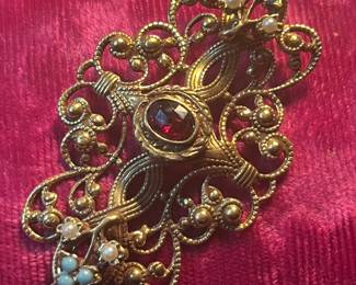 Large & incredible French brooch circa 1800 with a center garnet, seed pearls and turquoise.  Gold filled and stunning
