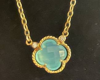 Aquamarine and diamond quatrafoil by Van Atkins Jewelry.
