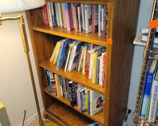 Wood bookcase. Books. Floor lamp