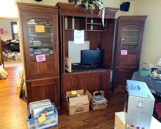 Entertainment center. Will separate. Small flat screen TV. CDs, DVDs Records, cassettes