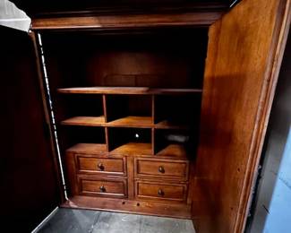 $1200 USD      Tommy Bahama Wood Armoire Wardrobe Entertainment Center WDI224-32     Transform your bedroom into a luxurious oasis with the Tommy Bahama Armoire Wardrobe Entertainment Center. This sleek and stylish piece not only offers ample storage space for your clothing and accessories, but also features built-in entertainment options. Enjoy the convenience and elegance of this multifunctional wardrobe.

Dimensions: 60  x 24 x 69.5H in  |  Interior TV space 50 x 39H in

Condition: New

Location: Local pick up Portland, OR 97224.  Shipper suggestions available upon request.     https://goodbyhello.com/products/copy-of-bernhard-armoire-entertainment-center-wardrobe-wdi224-31?_pos=12&_sid=f1836dac0&_ss=r