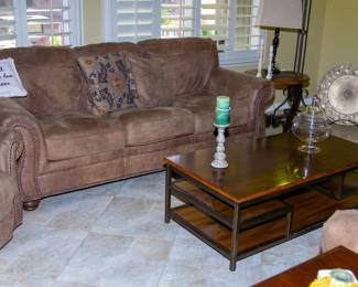 Plush leather sofa and wooden top coffee table