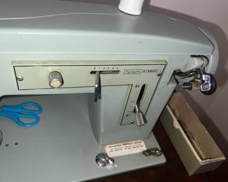 Sewing machine and table