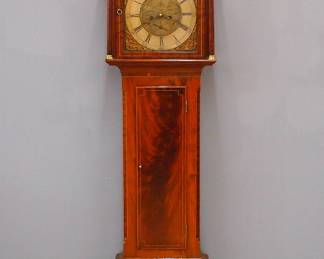 A late 18th century Scottish grandfather clock by "George Murray, Donn (Doune)".  8-day weight driven time and strike movement with arched Brass dial and Silvered chapter ring with Roman numerals, cast Brass spandrels and subsidiary seconds and date dials.  Mahogany case with contrasting Satinwood inlay features a classic broken arch crown with Brass finials above an arched dial door flanked by turned columns with Brass capitols and bases over a rectangular waist door and molded base with short bracket feet.  Older refinishing with minor wear, some shrinkage and minor damage, running when cataloged.  84 3/4" high.  
