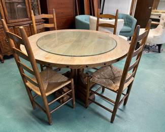 Solid wood round table $300 and four ladderback cane chairs - $75 each