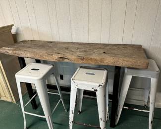 Live-edge unfinished oak bar - $400 
6 metal barstools available, two with grey tops and 4 all white -25.00 each  (sold separately).
