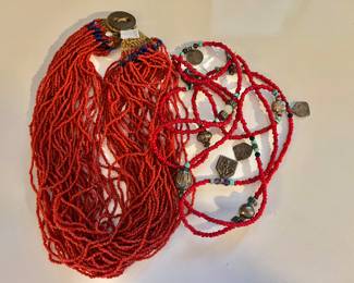 Multi strand coral and medallion necklace