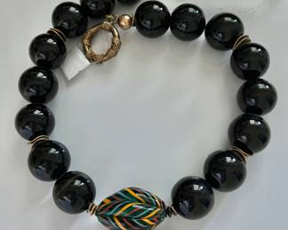 Black beaded necklace , art glass pendant