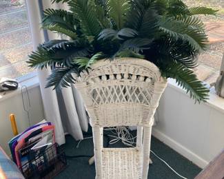 Here is a wicker plant stand
