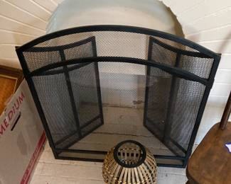 A nice black metal fireplace screen