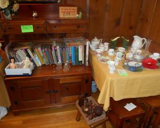 Custom made bookcase sporting books, assorted glassware
