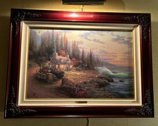 Walls filled with Thomas Kinkade art.