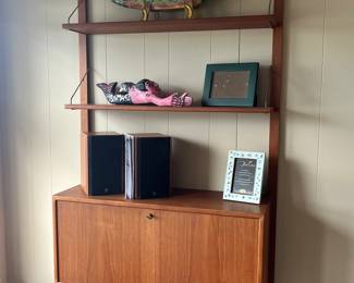 $1600 for the pair obo. Mid century modern teak drop desk wall unit with three shelves. as found. Sold with cabinet in prior photo as a set. Will separate if two people interested in each piece. 34.5"w x 12.5"d x 78" high as shown to top shelf. Upper shelves are 8.5"d. When desk is down it is 25" d. photo of desk down next.