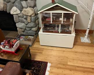 Antique dollhouse with antique furniture and modern furniture for sale during in-person shopping Friday and Saturday.