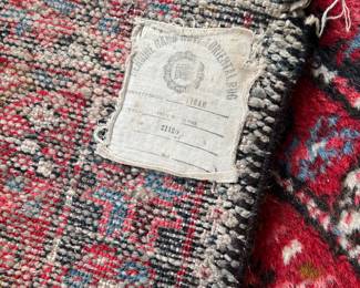 ticket on the back of the rug