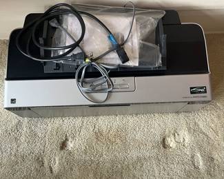 $50 Epson Stylus Photo R2880 large format with 9 unopened ink cartridges not working so may be best for parts.