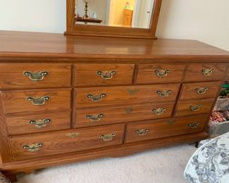 there are 2 matching  full bedroom sets.  Each bedroom has a dresser, night stand, mirror, headboard and mattress sets.